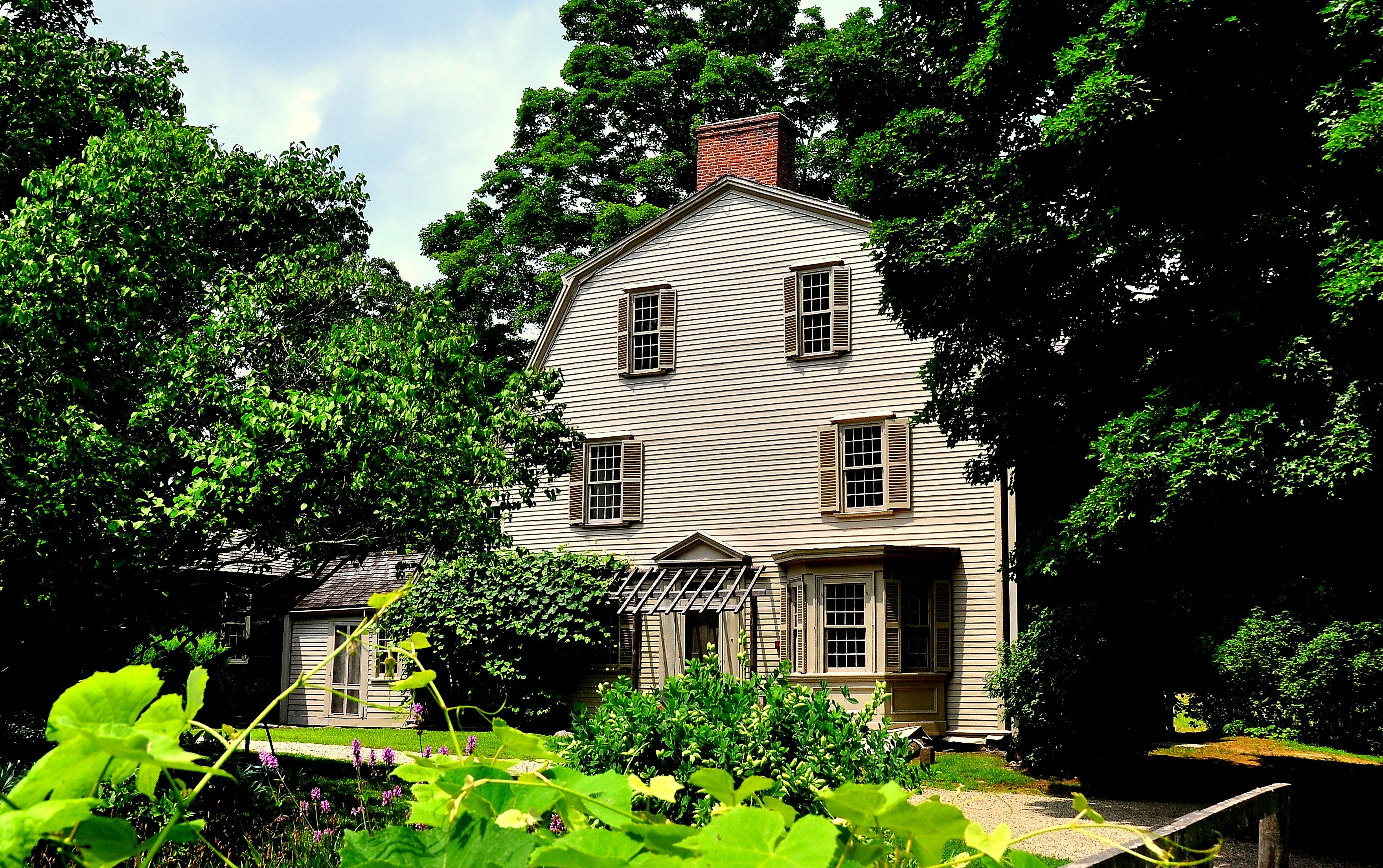 Brown home with gambrel barn roof